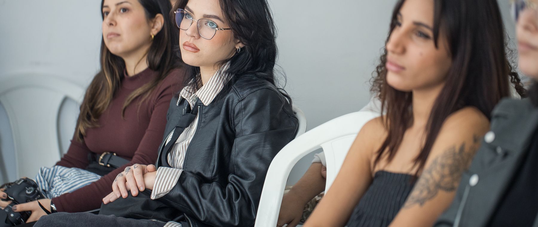 An engaged audience listening intently to a speaker